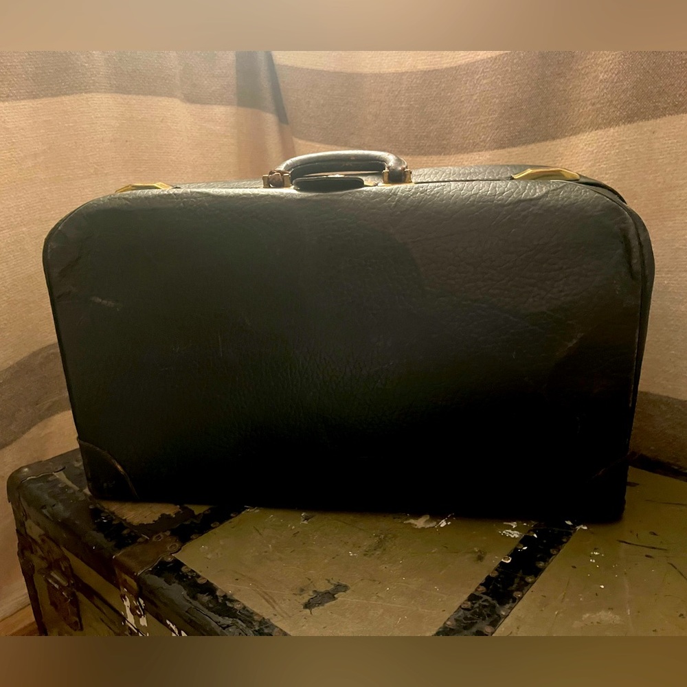 Vintage cowhide leather suitcase